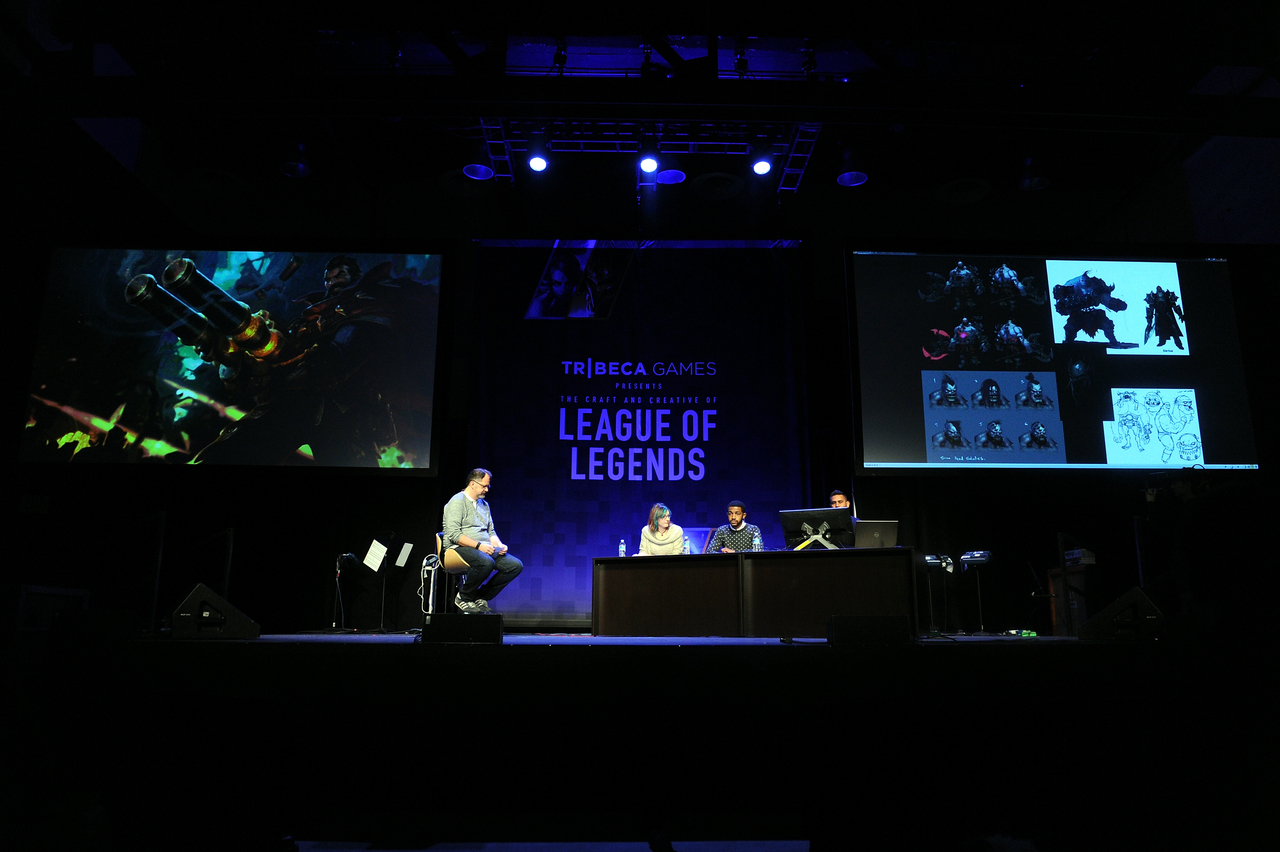 Shannon Berke, Evan Monteiro and Josh Singh speak on their panel, ART DEMONSTRATION BY LEAGUE OF LEGENDS ARTISTS, moderated by Tad Leckman (L).