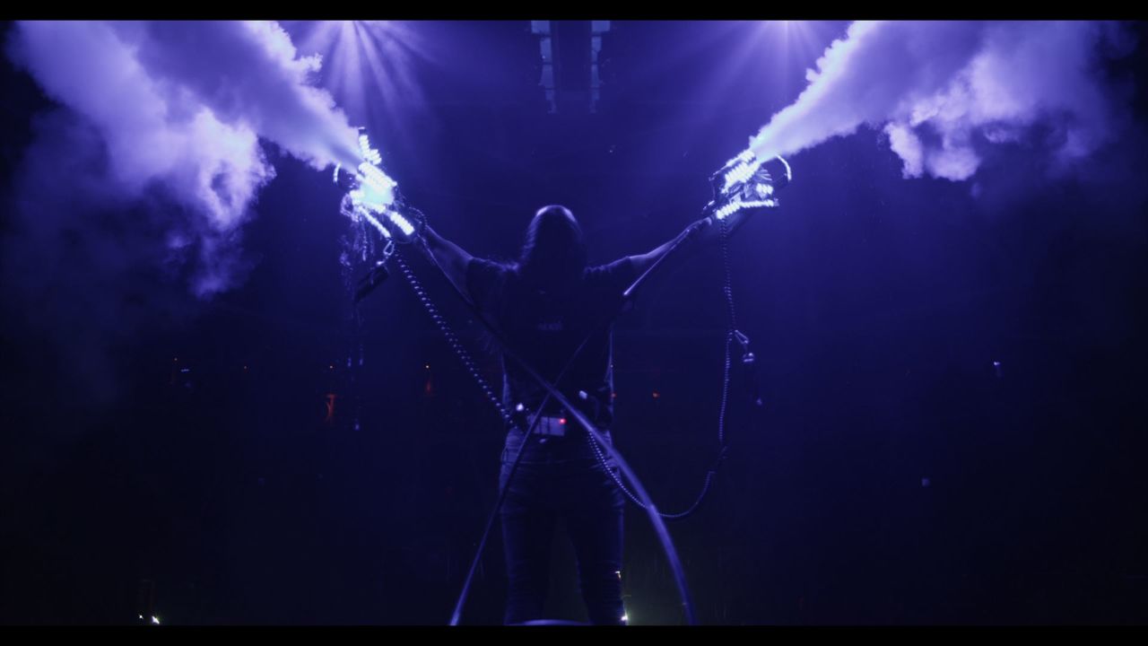 Steve Aoki on stage during one of his shows, as seen in I'LL SLEEP WHEN I'M DEAD.