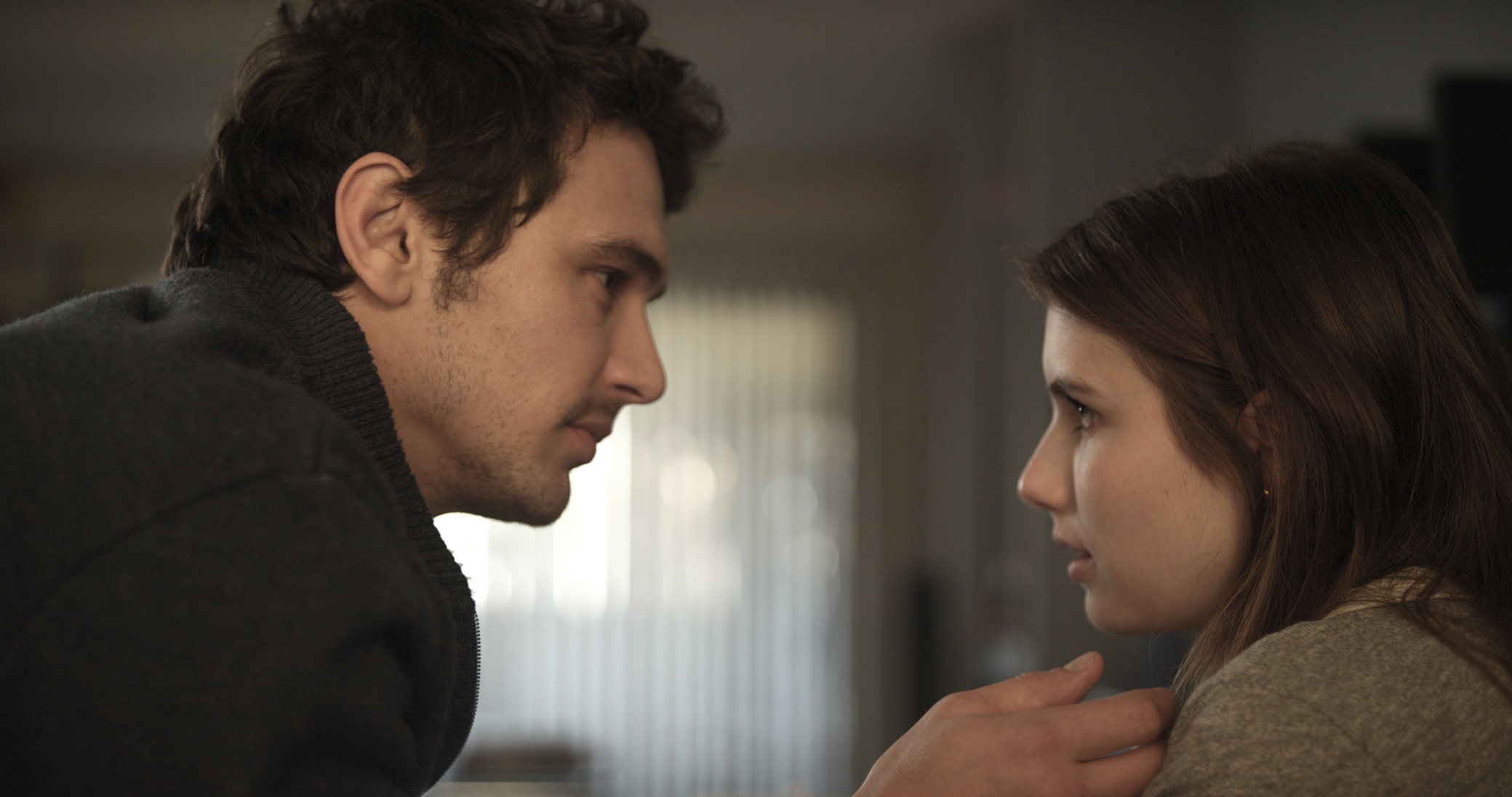 Image is from the film 'Palo Alto' (2013).  A teenage couple are alone in a room together and look as if they are about to kiss.